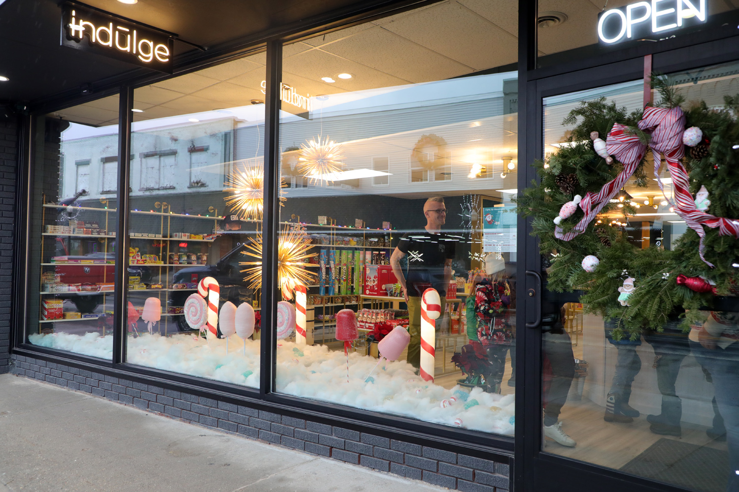 2023 12 09 AR Jeff Weaver inside Indulge Candy Store opened for business window night winner IMG 3794